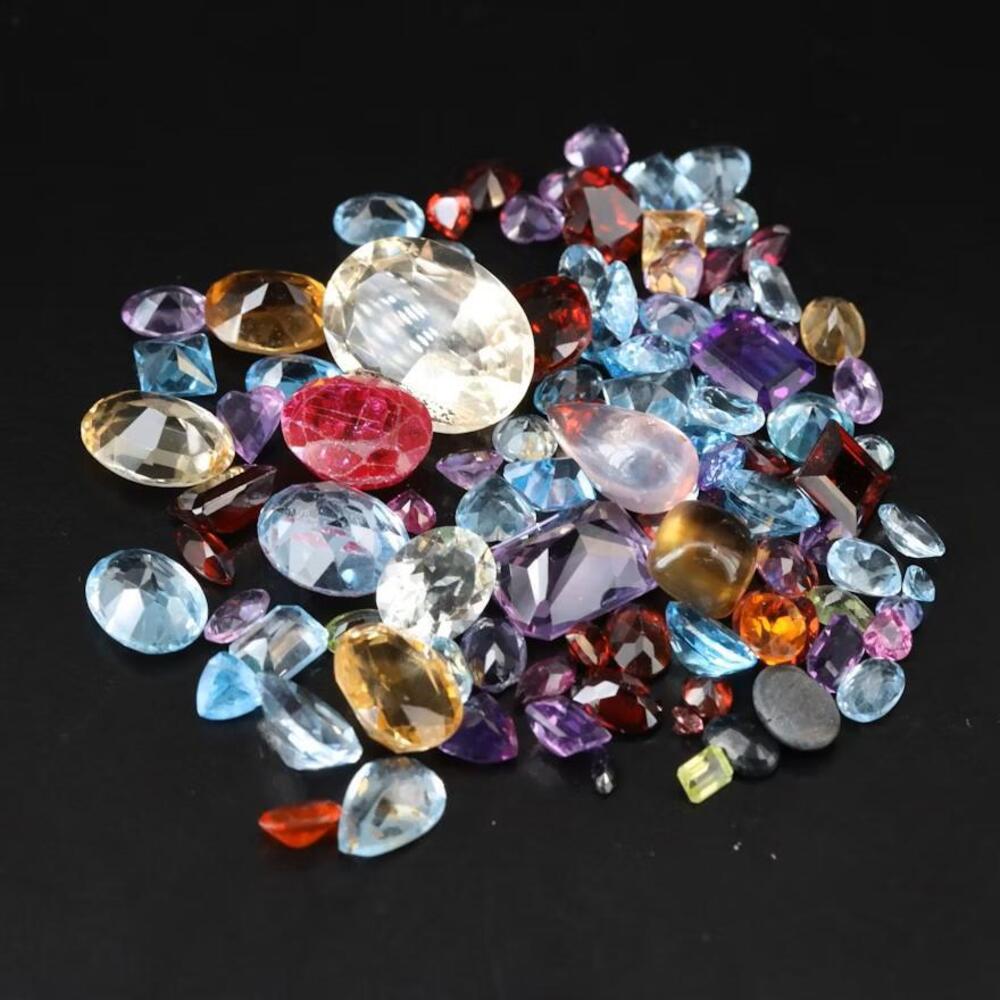 Loose 119.34 CTW Sky Blue Topaz, Amethyst, Citrine, and Gemstone Lot